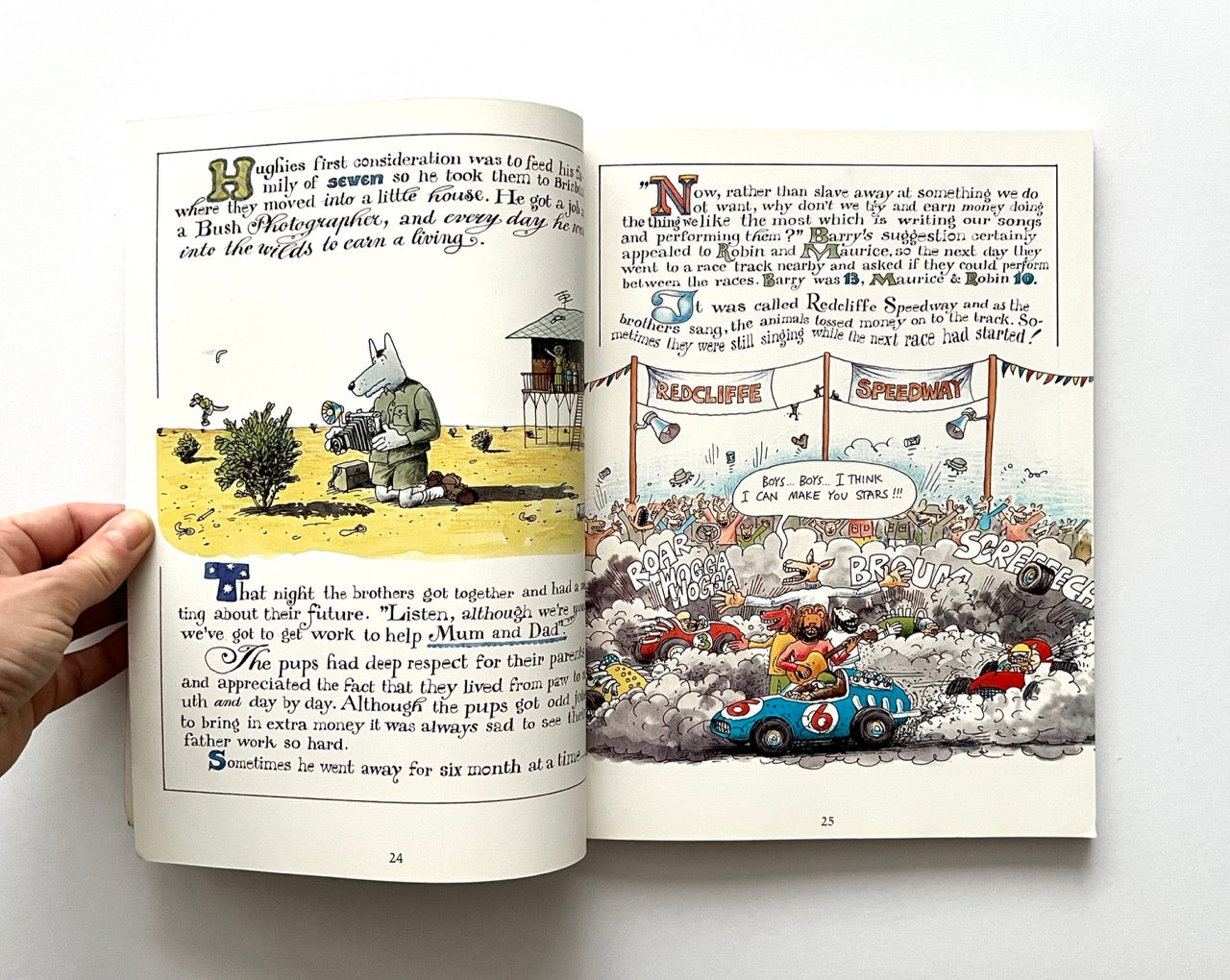 Open book with colorful illustrations and text on a white background