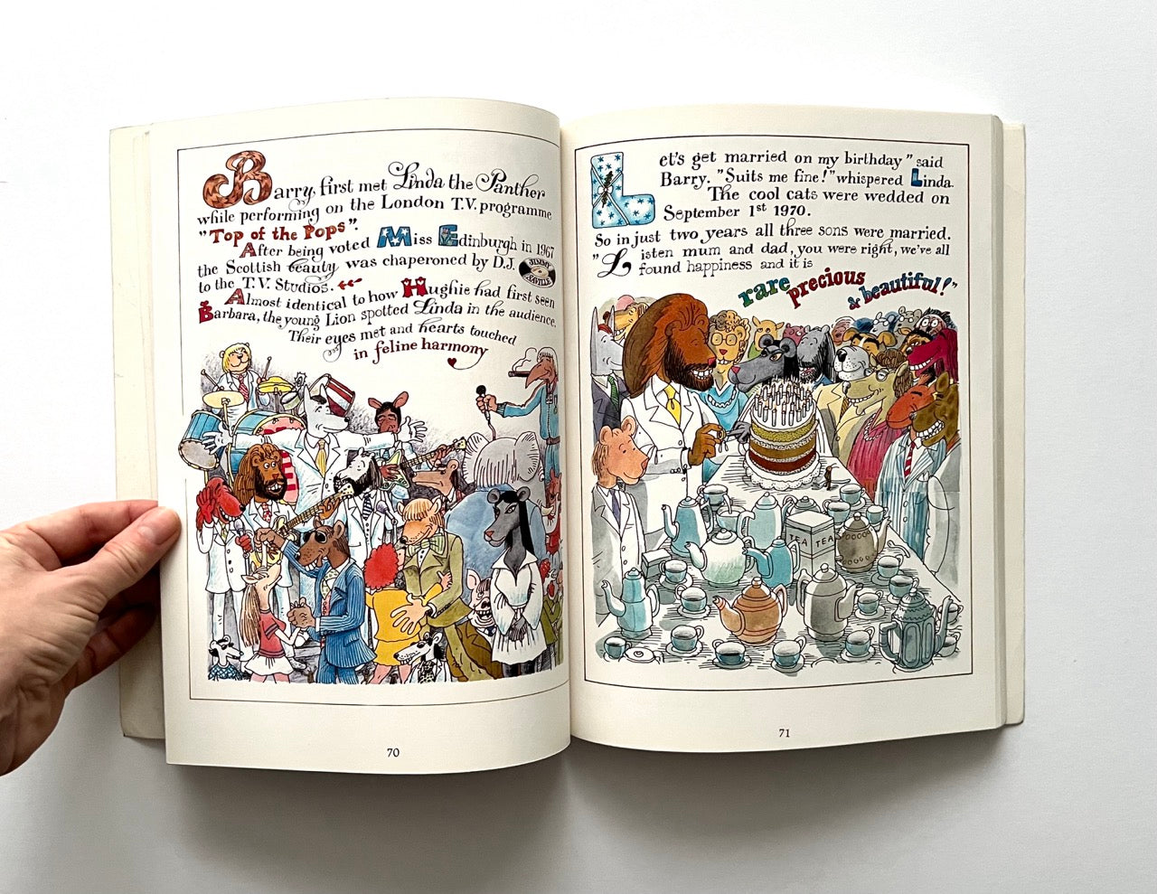 Open book - 'The Legend: The Illustrated Story of the Bee Gees' - with illustrated pages on a white background