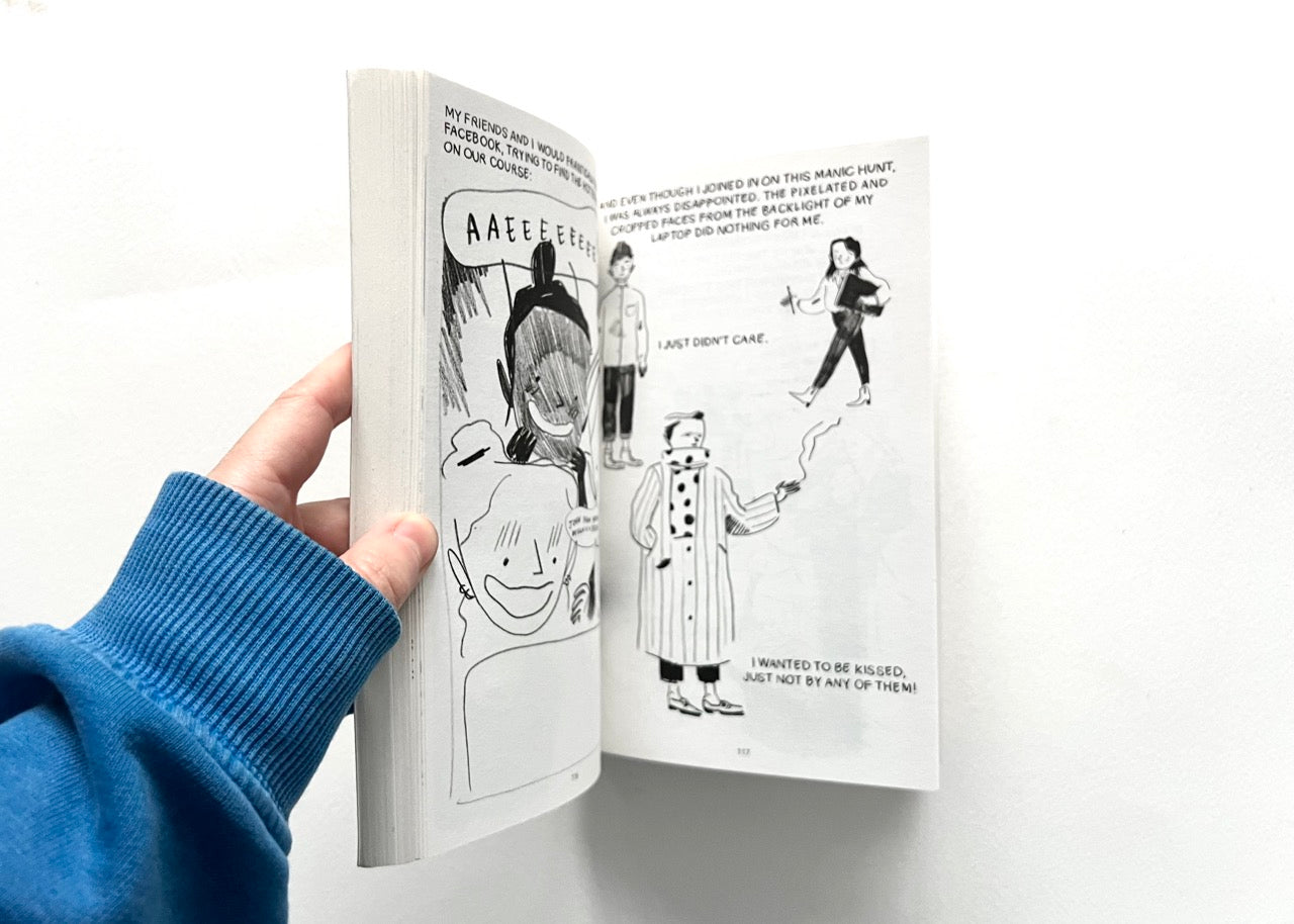 "THE TIMES I KNEW I WAS GAY" 
by Eleanor Crewes, open to an llustrated page with various characters.