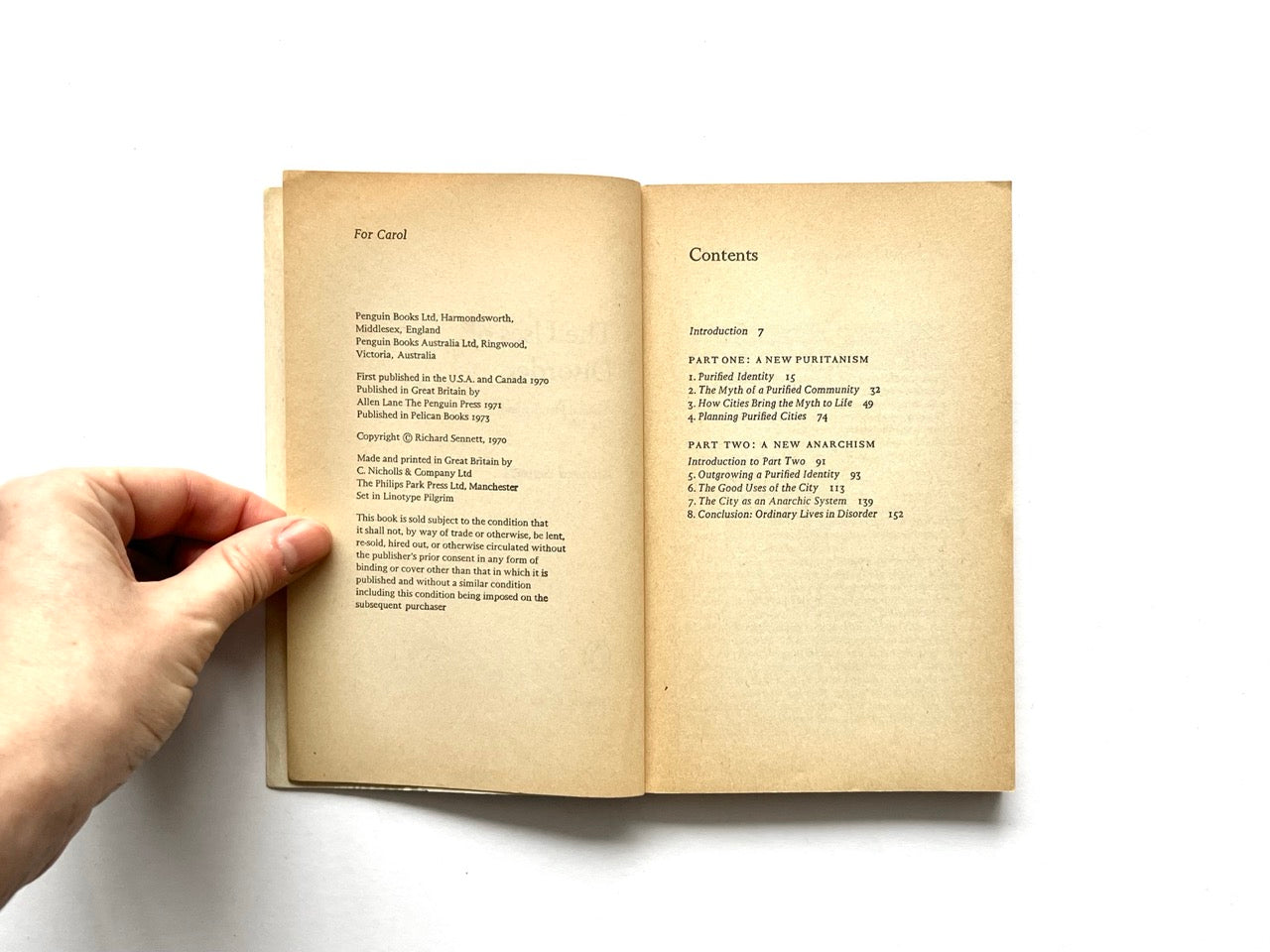 Copyright, dedication, and contents page spread of The Uses of Disorder by Richard Sennett, showing yellowed pages, a dedication (“For Carol”) and publication details on the left, and a contents list outlining chapters on identity, anarchism, and city life on the right.