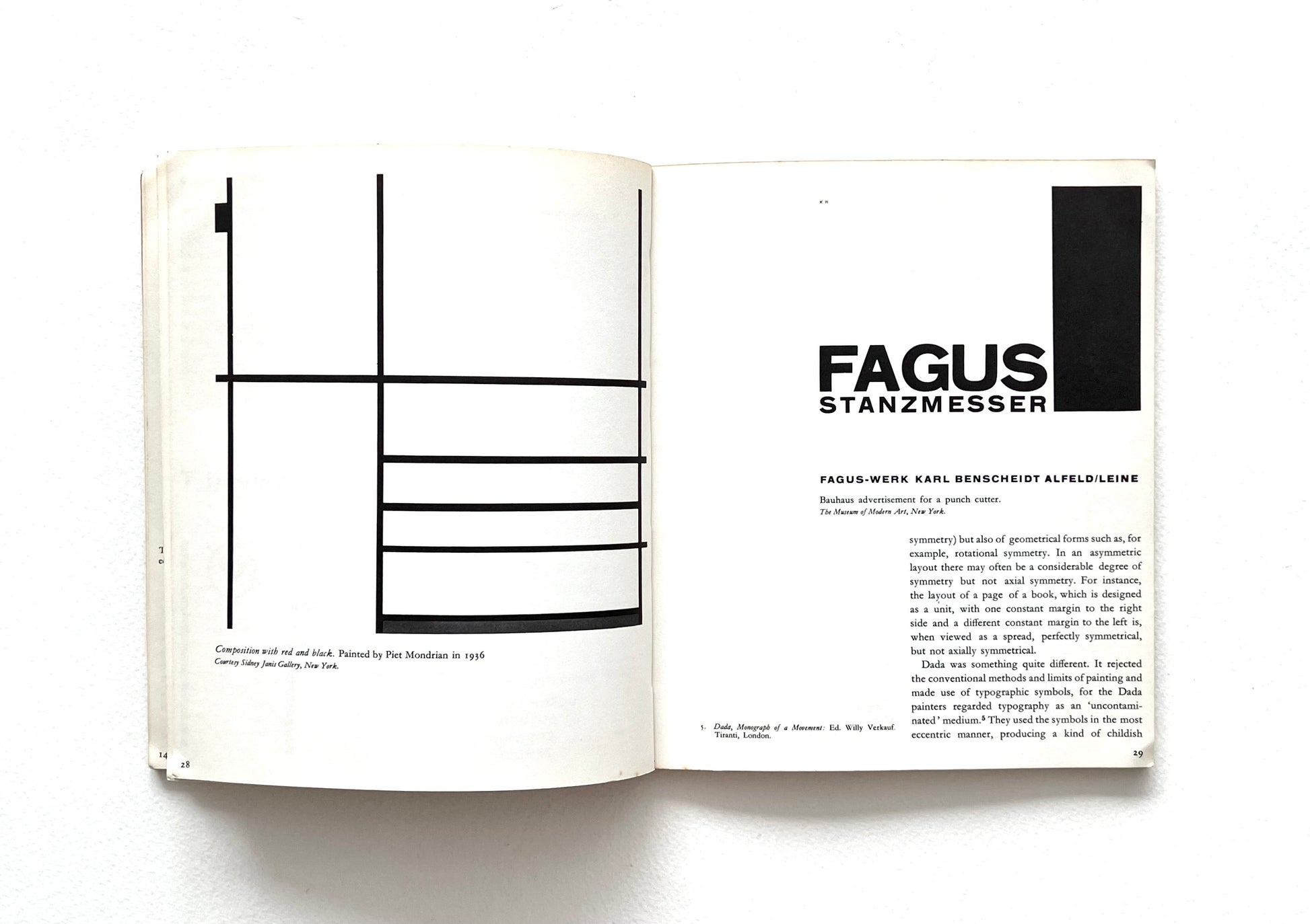 Open book showing a minimlasit design with geometric lines and text on a white background