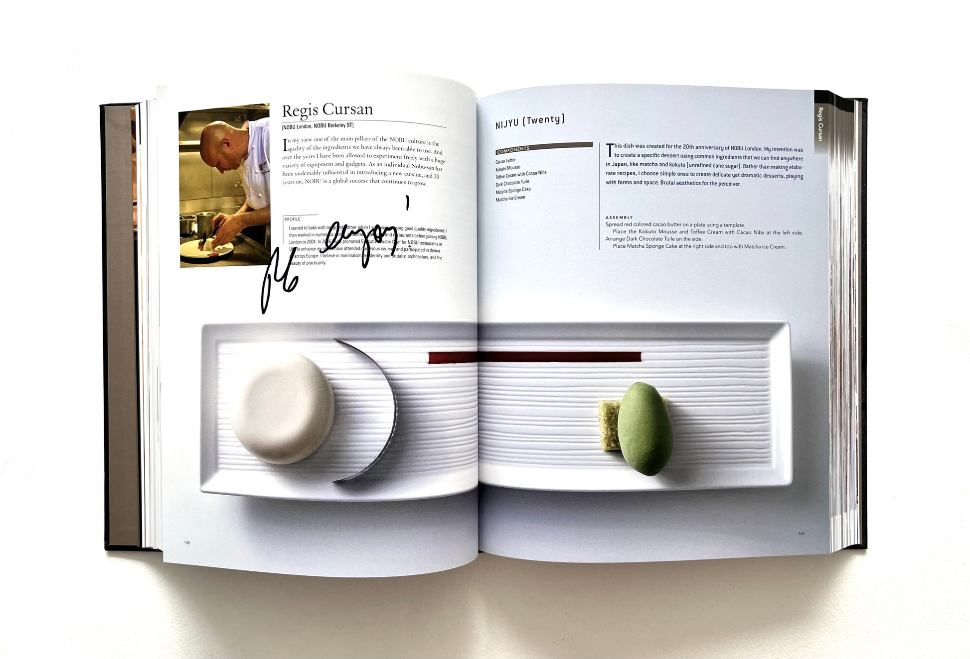 Open "World of Nobu" cookbook with a recipe and photogrpah of a NIJYU dish - signed by chef Regis Cursan.