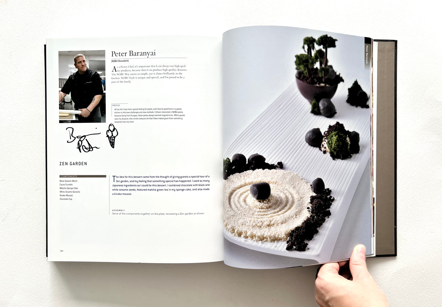 Open "World of Nobu" cookbook showing a recipe and a photo of a ZEN GARDEN dish - signed by chef Peter Baranyal.