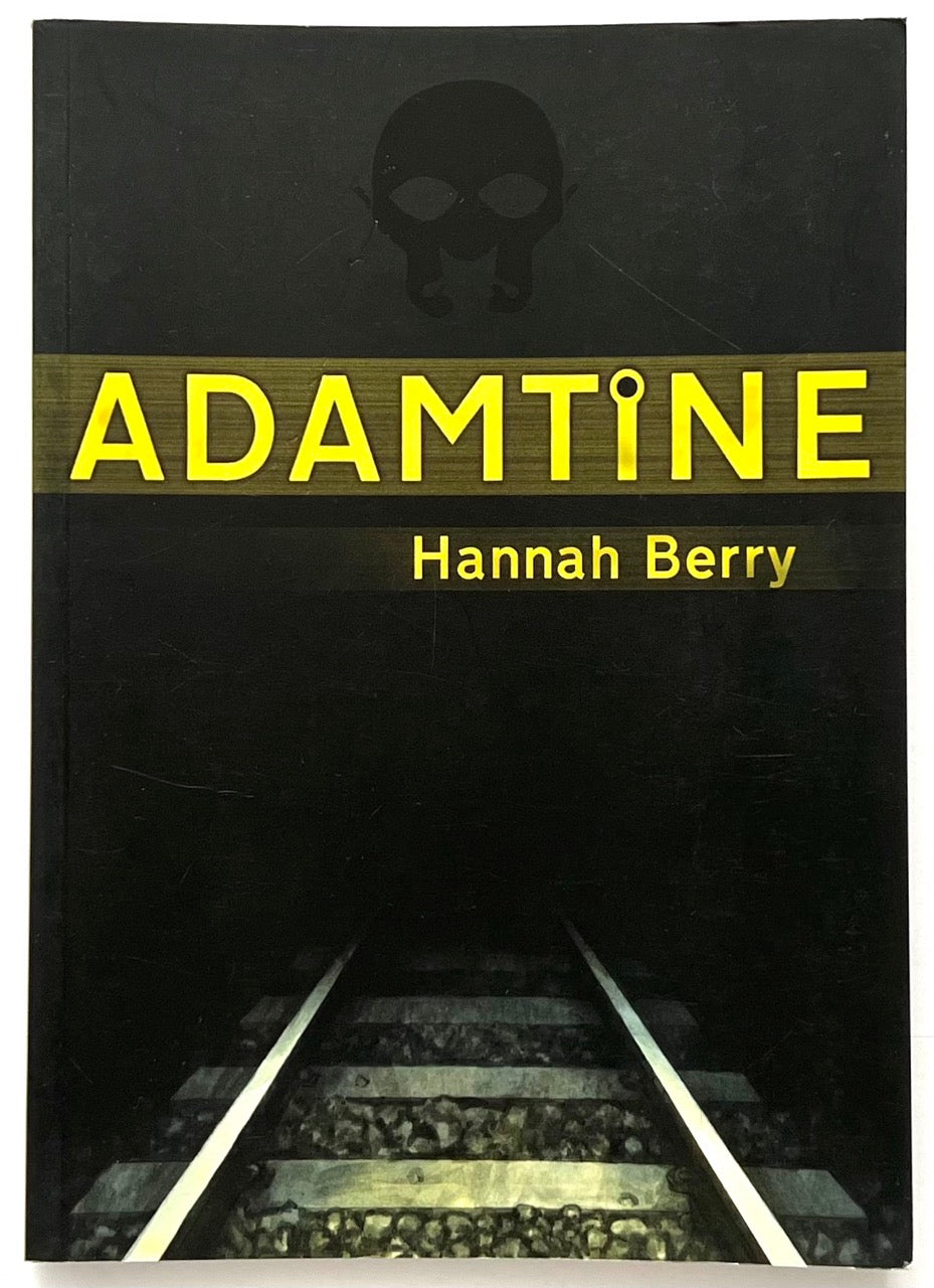 Adamtine by Hannah Berry, 2012 graphic novel, front cover showing dark railway tracks disappearing into tunnel with yellow title lettering on black background.