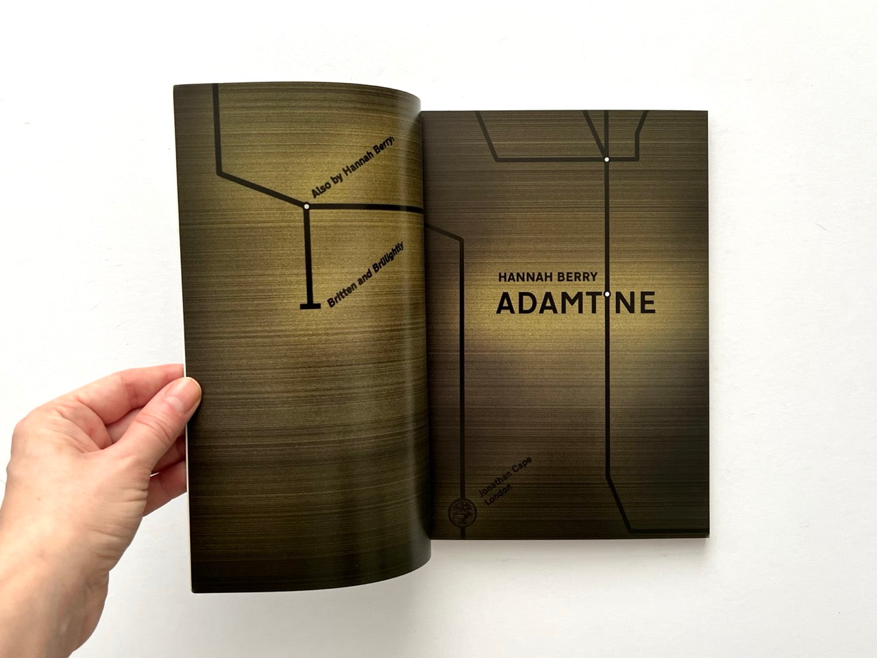Adamtine by Hannah Berry, 2012 graphic novel, title page spread with stylised underground map design and publisher imprint Jonathan Cape London.