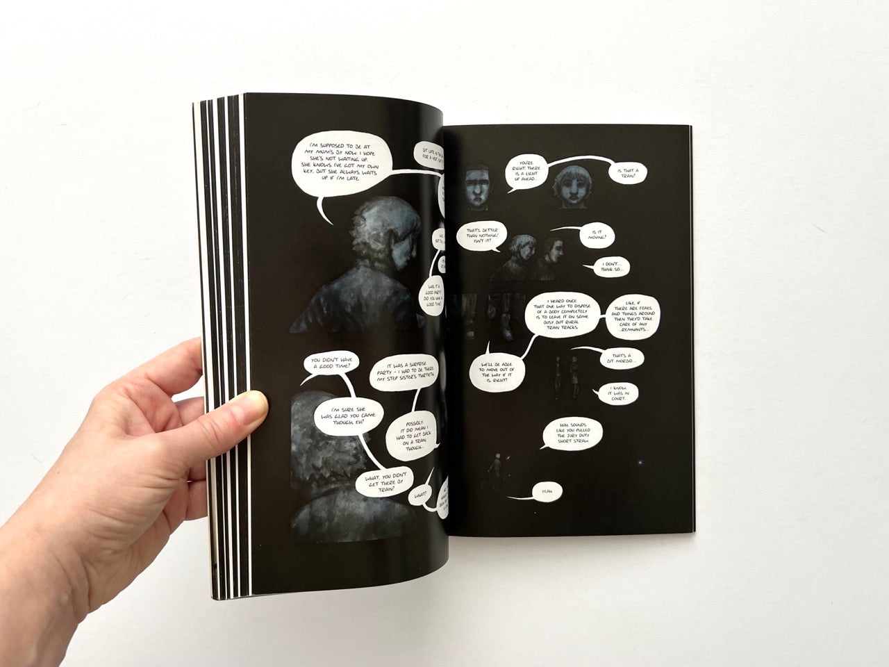 Adamtine by Hannah Berry, 2012 graphic novel, interior double-page spread with dark monochrome comic panels and dialogue bubbles, surreal underground scene illustration.