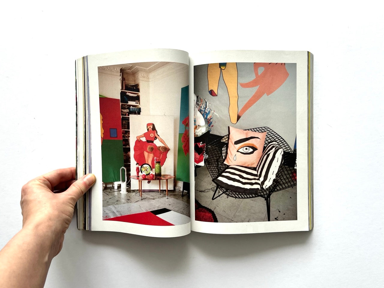 Apartamento Magazine Issue #21 – Interior spread featuring colourful interior with graphic wall panels, sculptural decor, and a chair with patterned cushions.