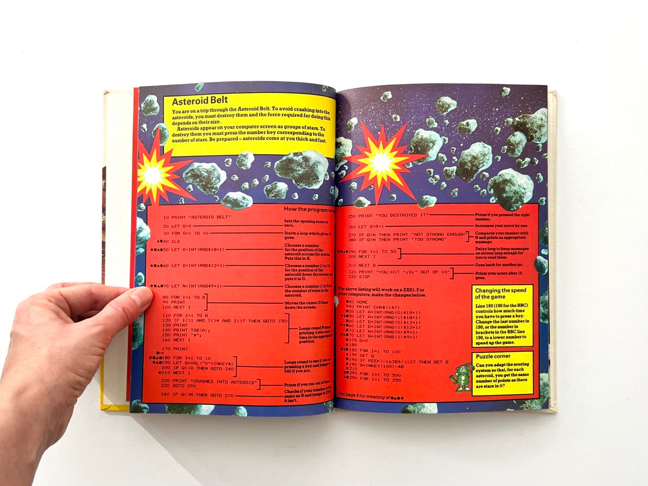 Interior pages from 1982 Usborne BASIC programming book showing Asteroid Belt game code with asteroid illustration and computer game listing