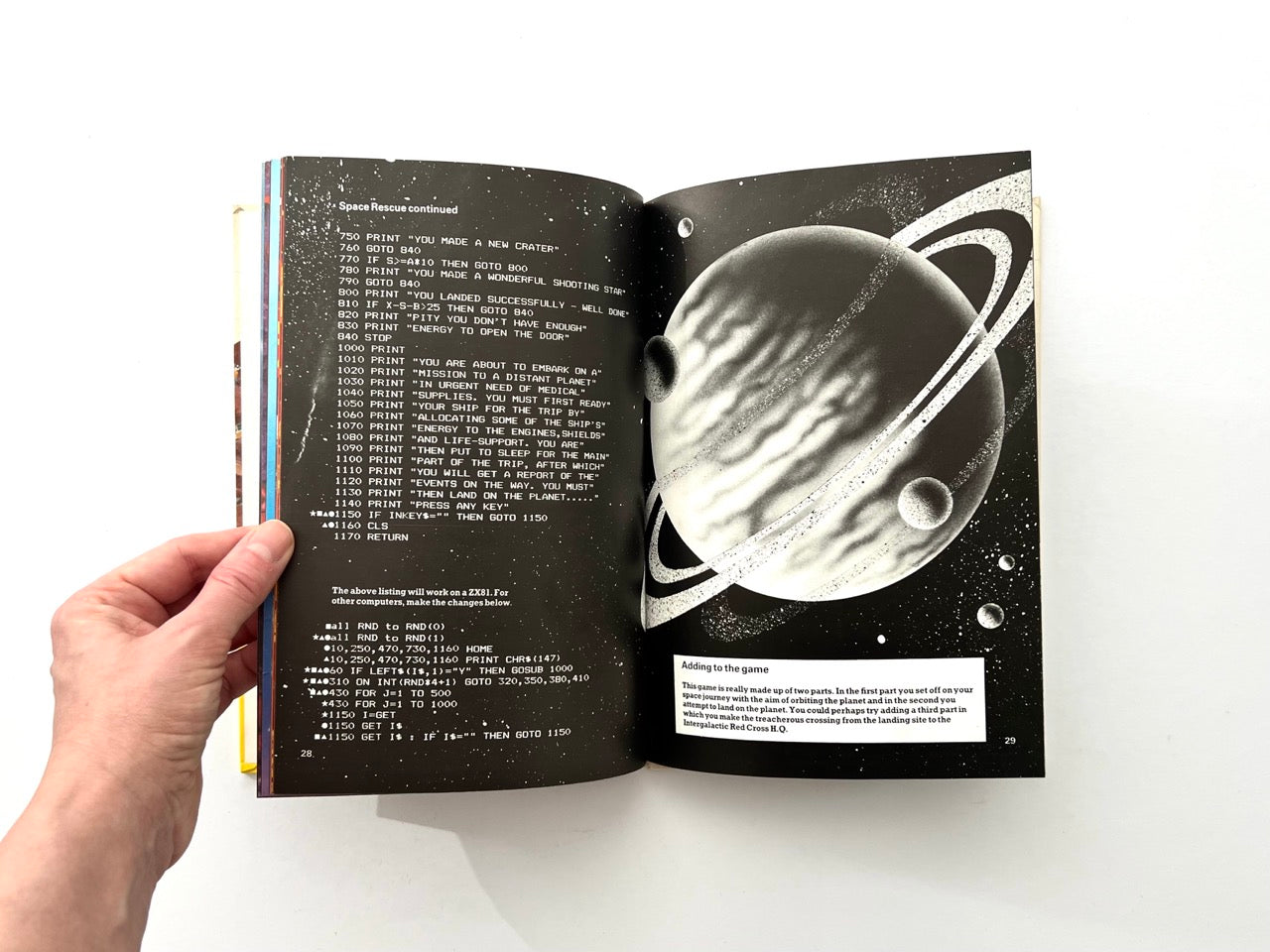 Interior pages from 1982 Usborne computer game programming book showing Space Rescue BASIC code listing with black and white planet illustration