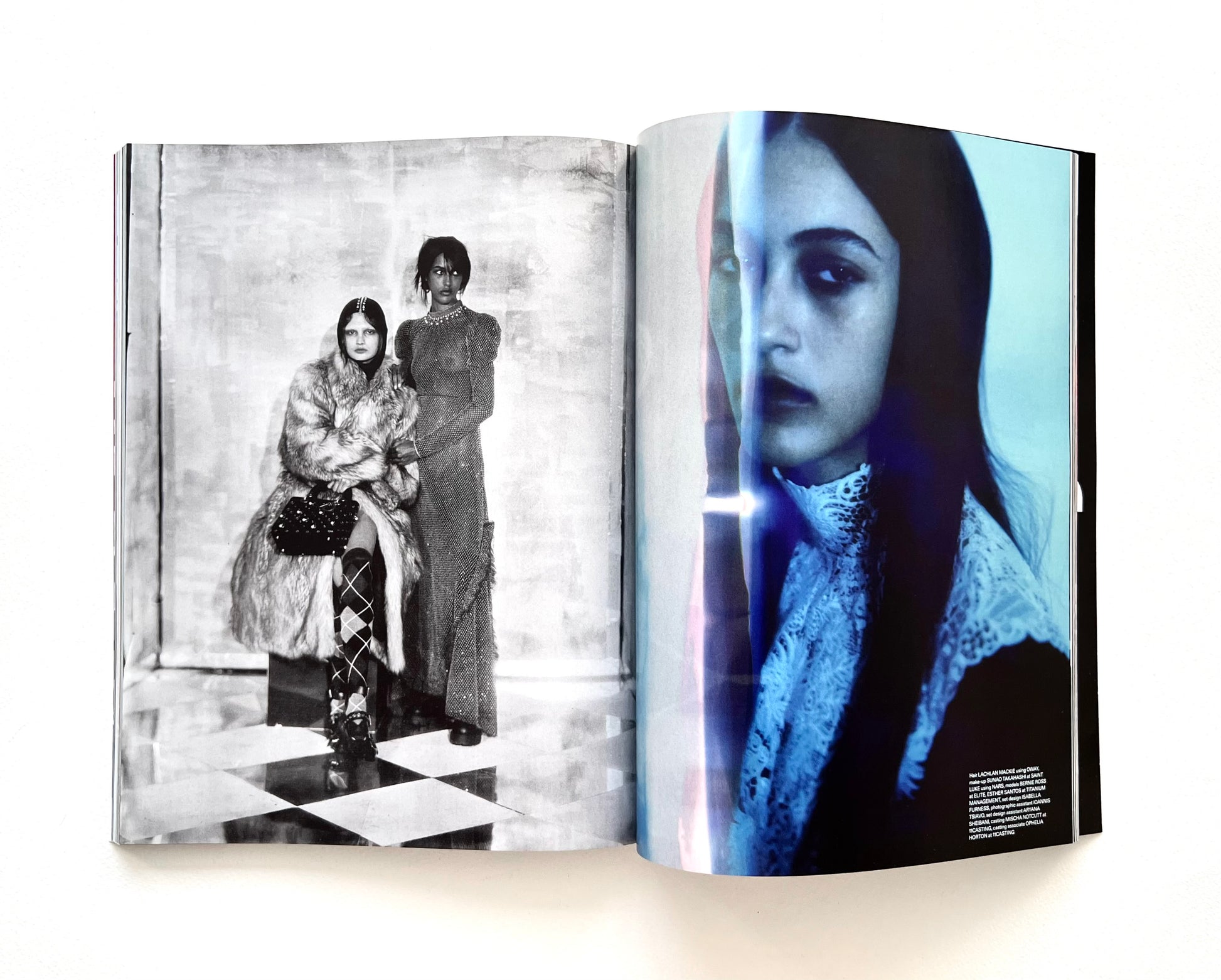 Open fashion magazine showing black and white and color photographs of female models.