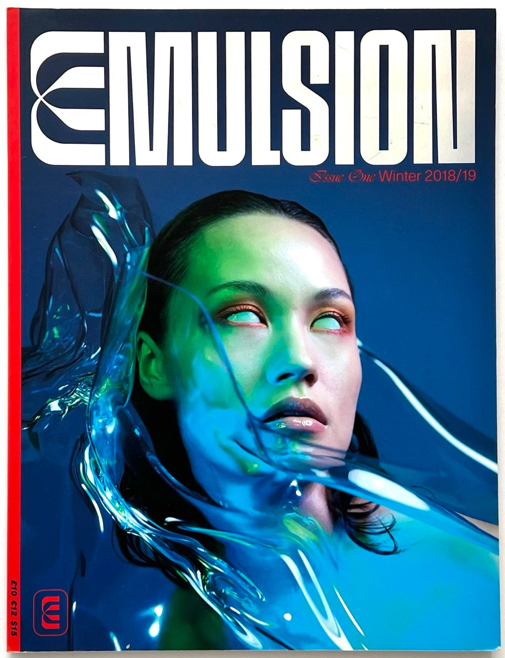 Cover of EMULSION Issue One Winter 2018/19 featuring a neon-lit portrait with liquid-like visual effects