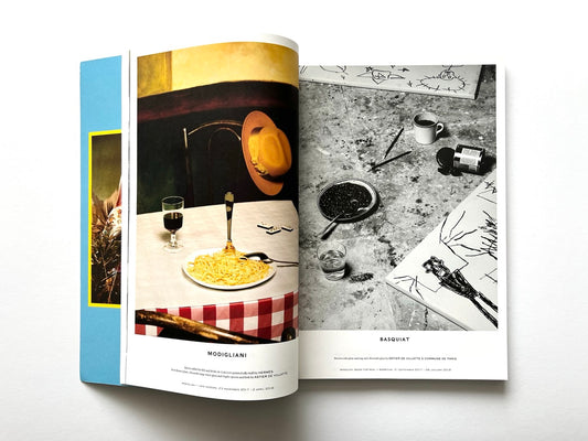 Open spread from Luncheon Magazine No. 4 showing a colour image of a table with spaghetti, wine and a hat referencing Modigliani on the left, and a black-and-white studio scene with paints and drawings referencing Basquiat on the right.