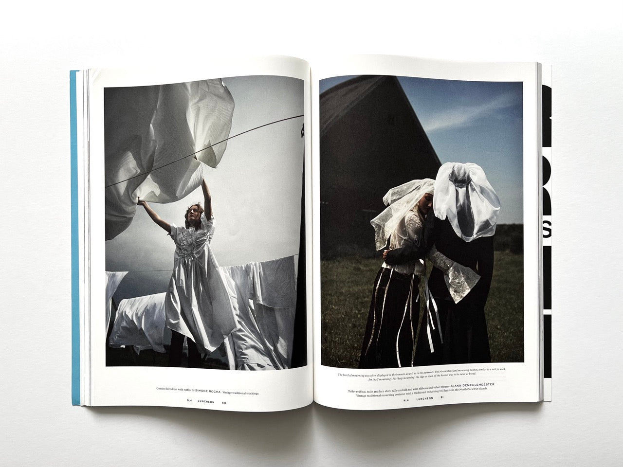 Open spread from Luncheon Magazine No. 4 showing a colour photograph of a woman lifting large white sheets on a clothesline on the left, and two figures wearing veiled traditional garments embracing outdoors on the right.