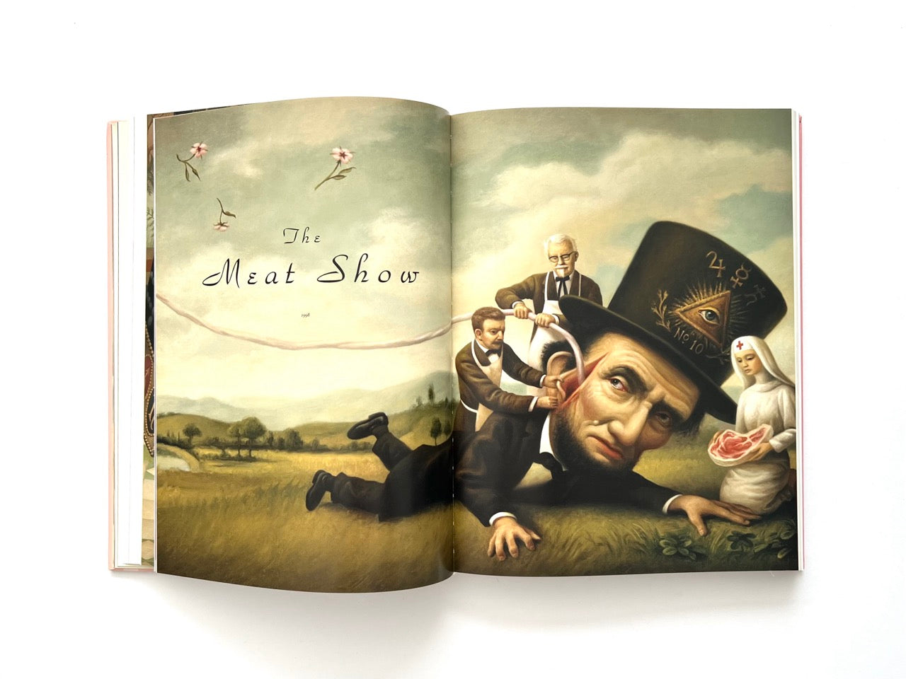Mark Ryden Pinxit interior spread titled “The Meat Show” featuring a surreal scene with a distorted Abraham Lincoln figure, attendants, and symbolic imagery in a pastoral landscape