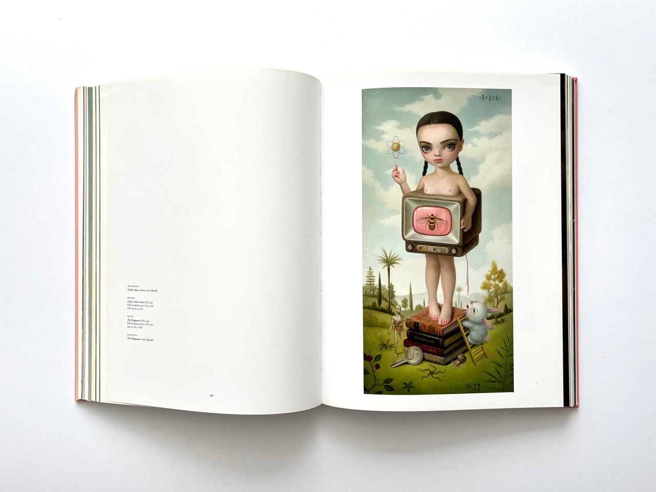 Mark Ryden Pinxit interior spread featuring a surreal portrait of a girl with braided hair and a television body displaying a bee, standing on a pile of books in a dreamlike landscape