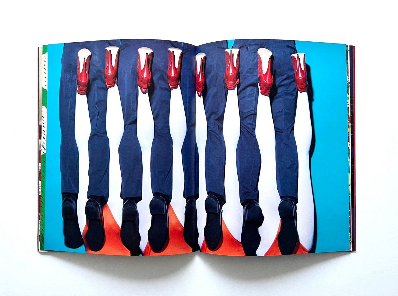 Magazine spread (Toiletpaper No. 7, December 2012) with male and female legs arranged in a pattern.